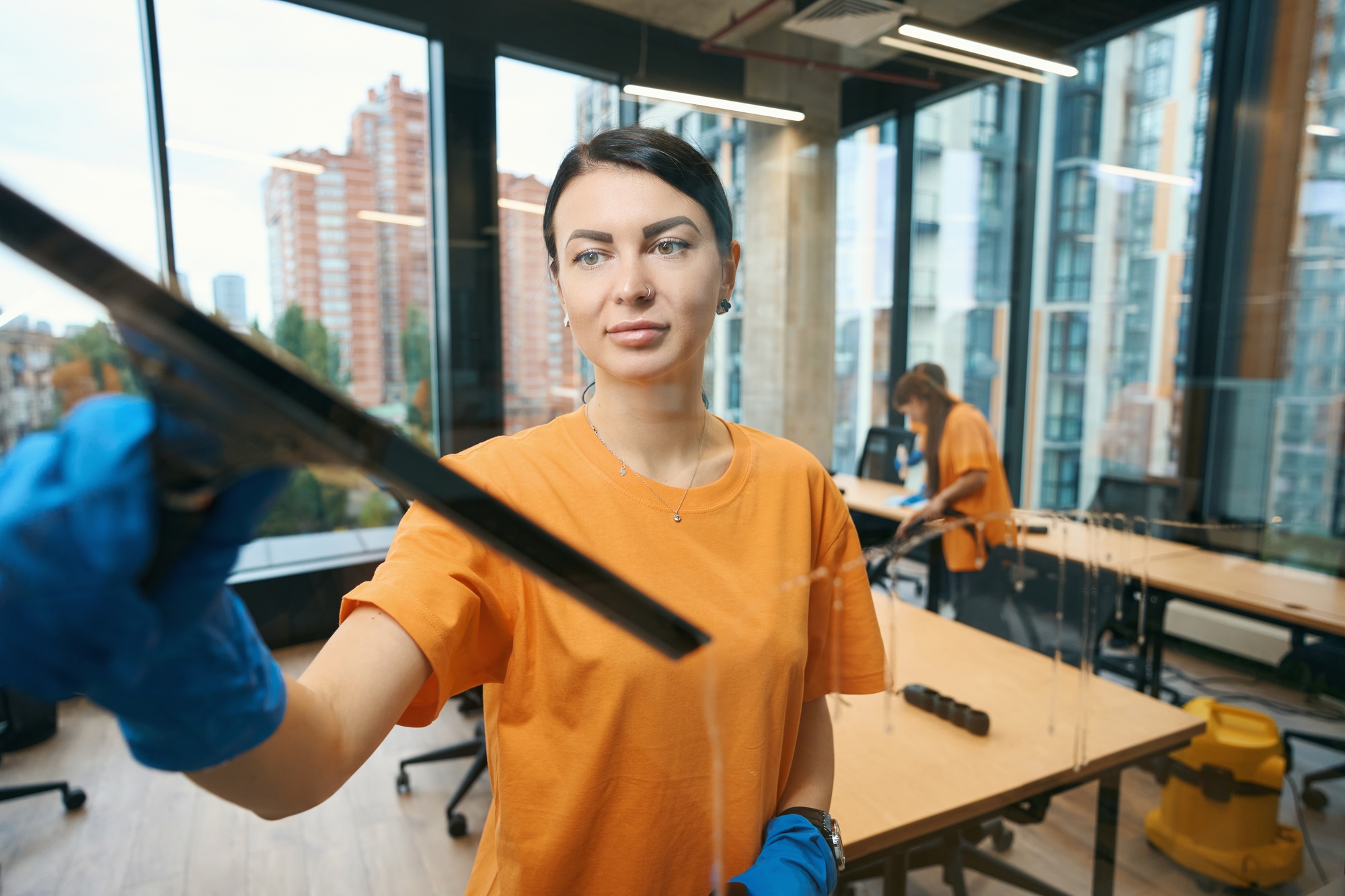 Cleaning company workers use different gadgets while cleaning and disinfecting